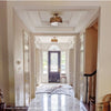 Adonis Semi-Flush Mount styled in a millwork ceiling. Styled view.
