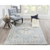 Amherst Rug styled with accent chair and table. Styled view.