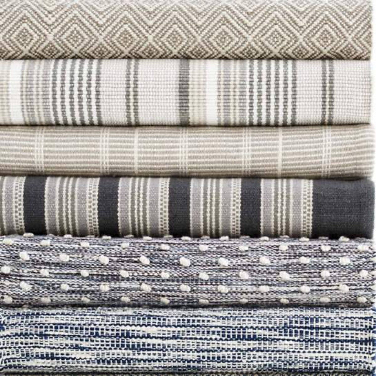 Annabelle Grey Indoor/Outdoor Rug styled with other rugs. Styled view.