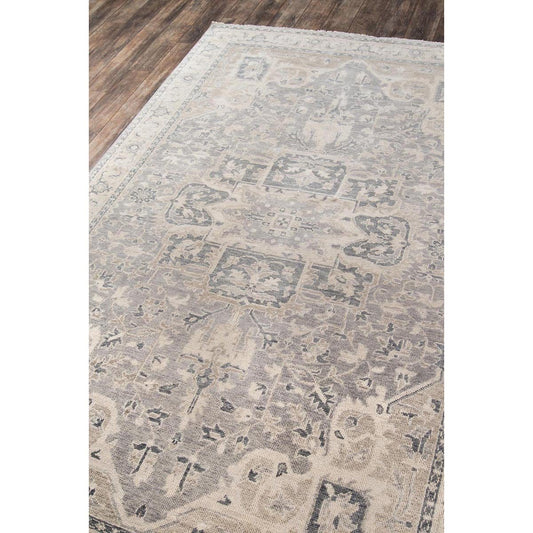 Anya Hand-Knotted Rug styled on wood floor. Styled view.