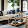 Ashley Coffee Table styled with books, vases and greenery and a blue and neutral living room. Styled view.