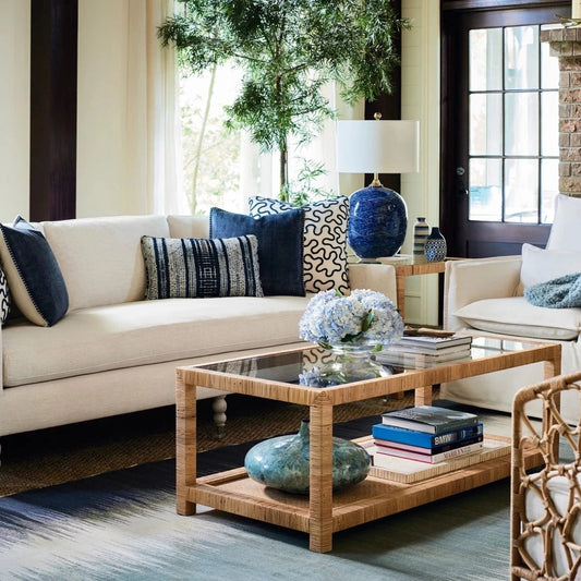 Ashley Coffee Table styled with books, vases and greenery and a blue and neutral living room. Styled view.