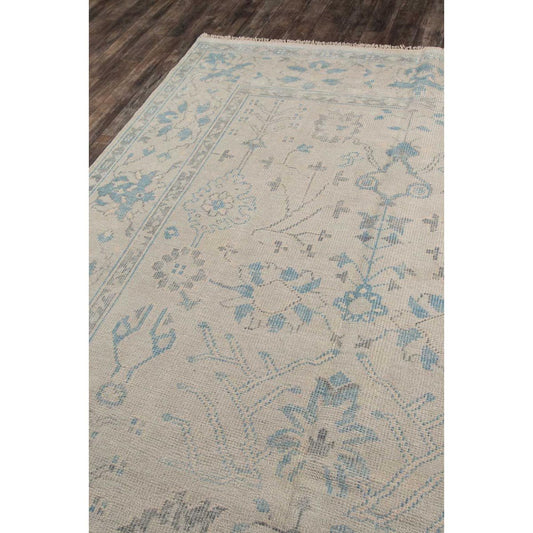 Azure Hand-Knotted Rug over wood floor. Styled view.