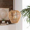Bungalow Pendant styled in a white room with neutral decor and greenery. Styled view.
