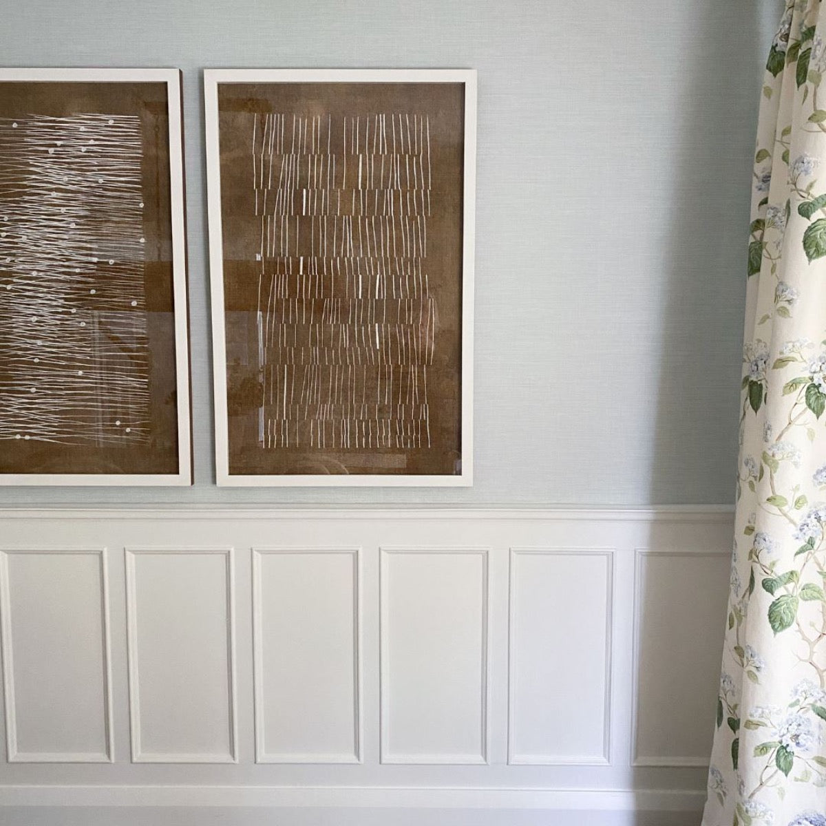 Burnt Umber Impressions I styled on a blue wall. Styled view.