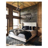 Cape Lantern styled above a black bed in a cabin Styled view.
