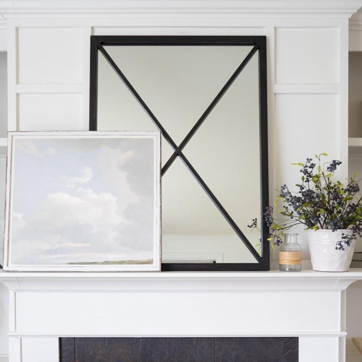 Cloud Study styled infant of a mirror over a mantel. Styled view.