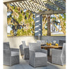 Coleford Outdoor Lantern styled above an outdoor table with grey wicker chairs. Styled view.