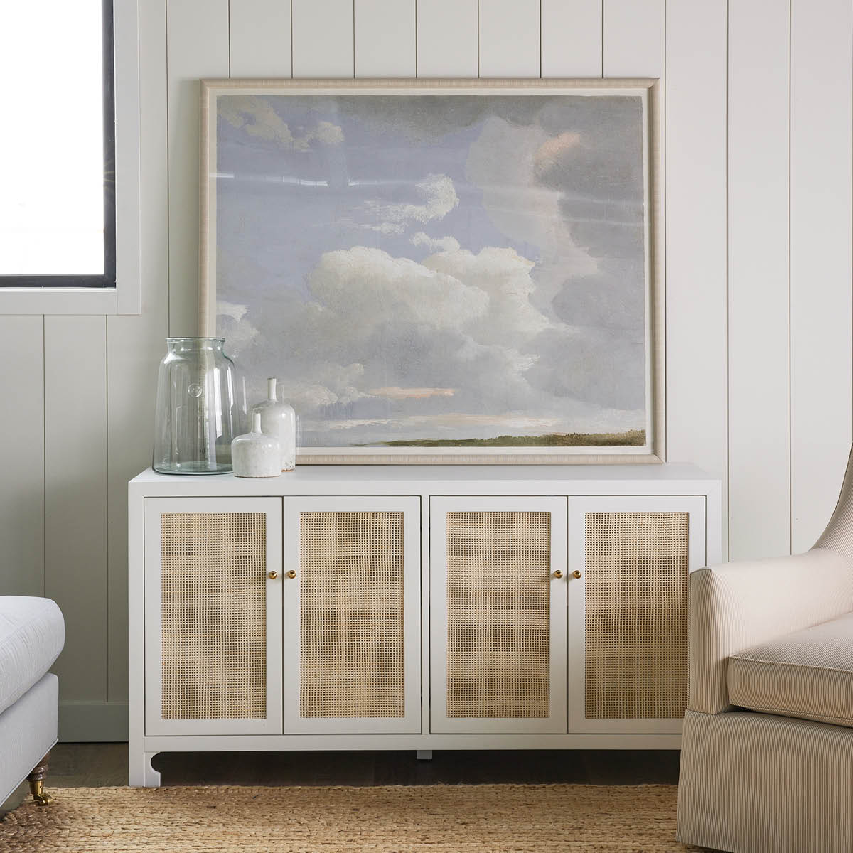 Colette Cabinet styled with sky artwork. Styled view.