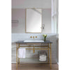 Davis Mirror styled in a bathroom with golden fixtures. Styled view.