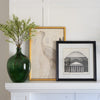 Demoiselle Crane styled on a white mantel with artwork and greenery. Styled view.