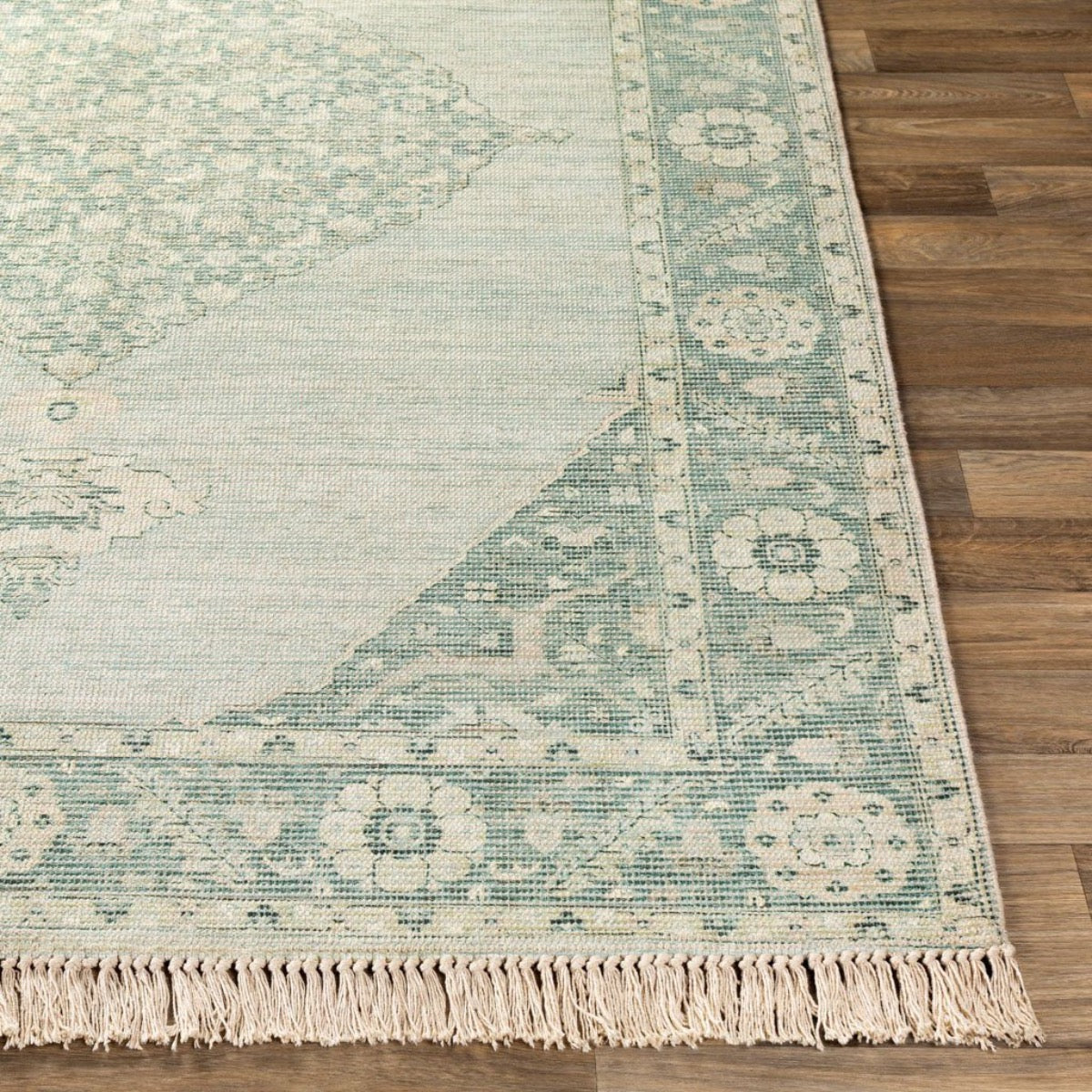 Ella Rug on a light wood floor. Styled view.