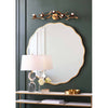 Erica Mirror - Large styled on a green wall with gold accents. Styled view.