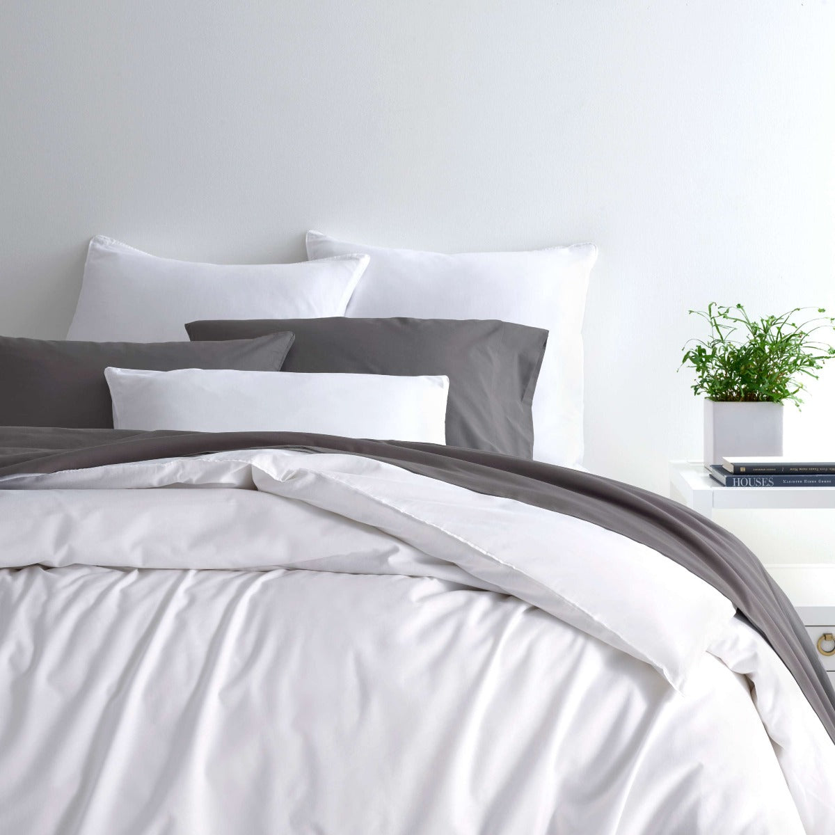 Essential Percale White Duvet Cover styled with grey sheets. Styled view. 