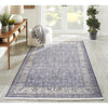 Finlay Rug - Blue styled in a hallway with console table and greenery. Styled view.