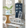 Sail Chandelier styled above a glass table with white wood chairs. Styled view.