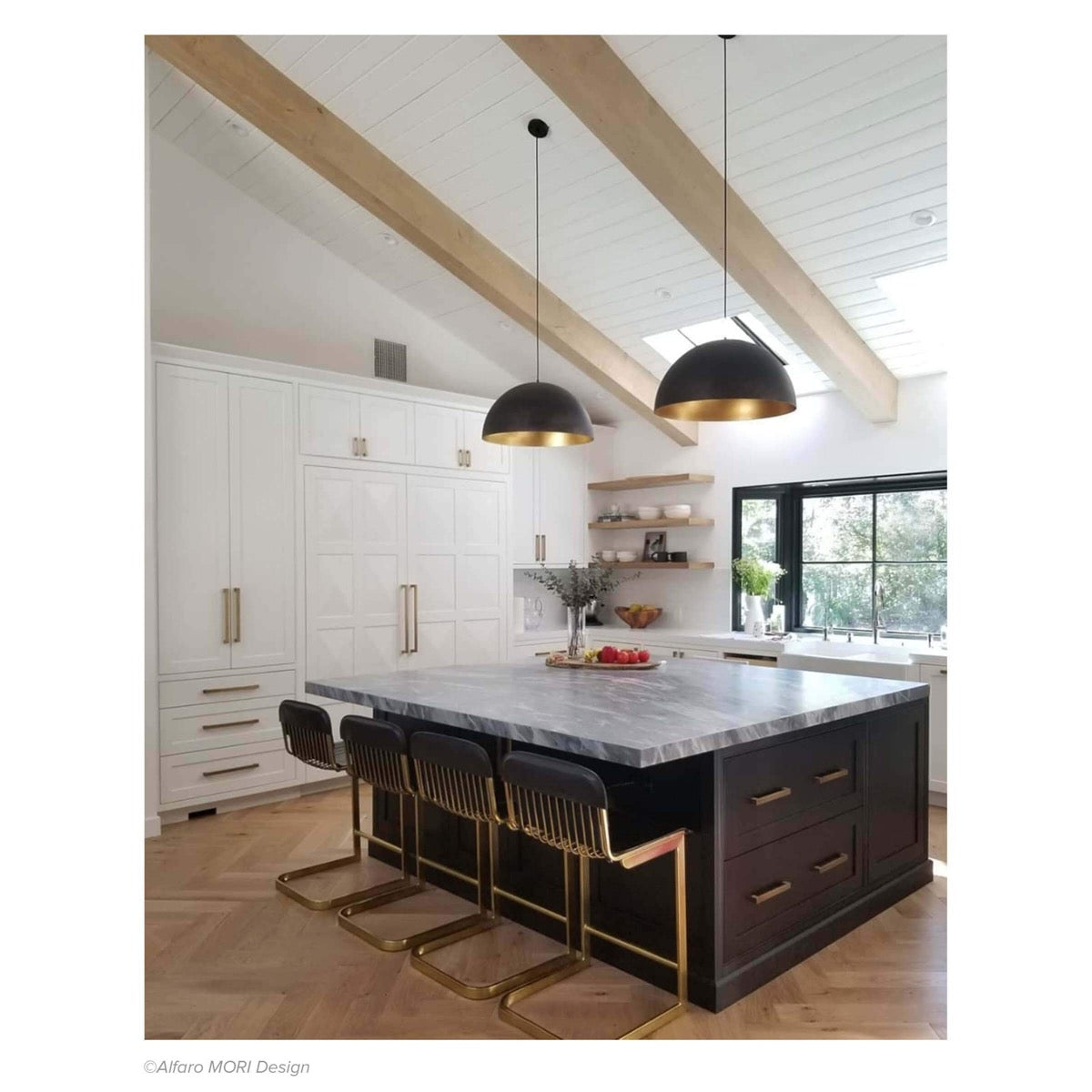 Flynn Pendant - Small Black & Gold styled over a kitchen island with decor. Styled view.