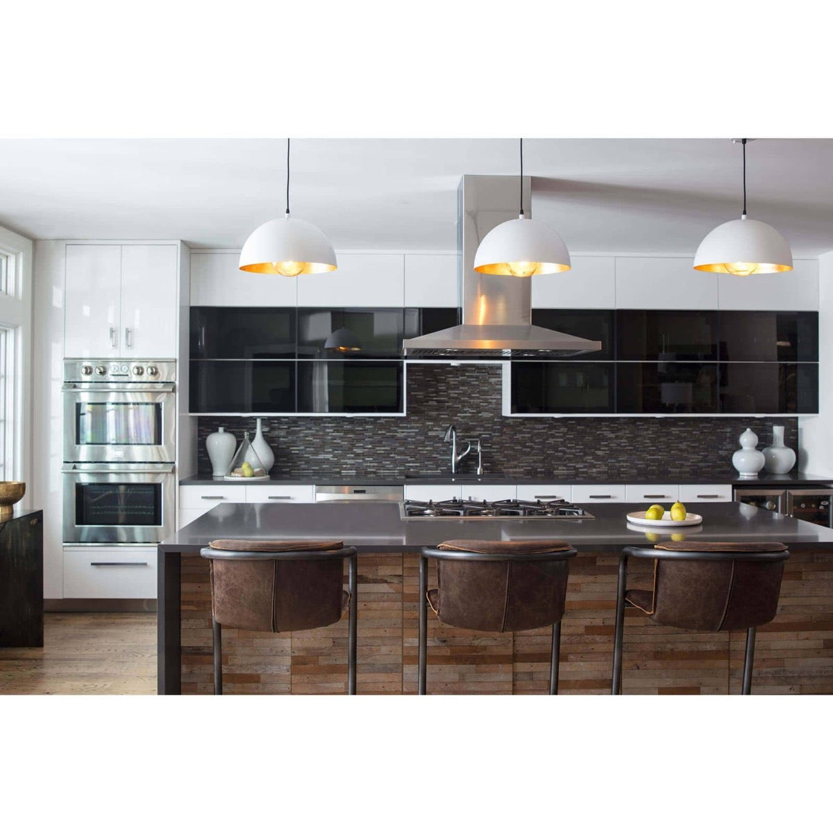 Flynn Pendant - Small White & Gold styled over a dark kitchen island with brown bar stools. Styled view.