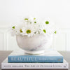Footed Marble Bowl - Large styled with florals on books. Styled view.