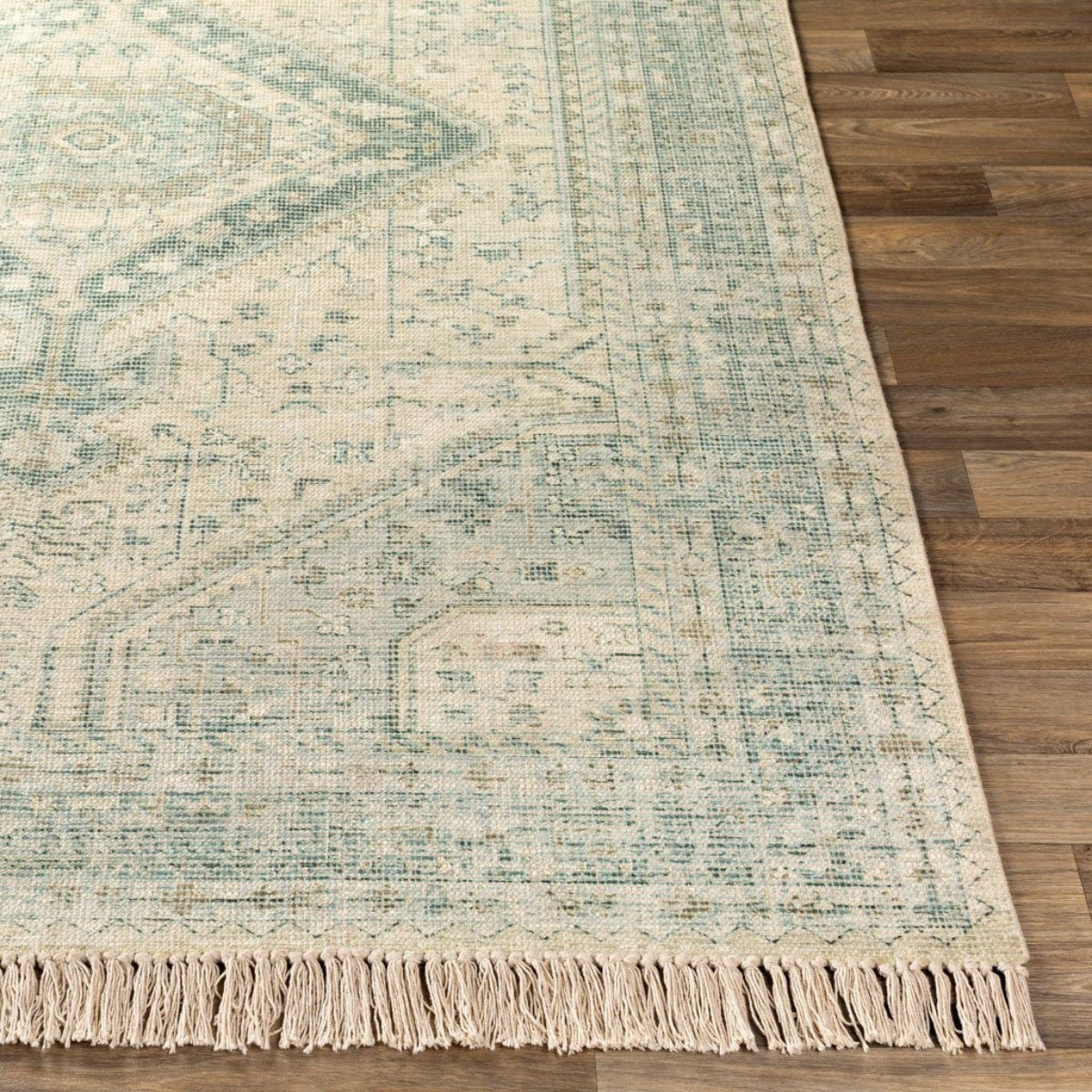 Georgia Rug corner on light wood floor. Styled view.