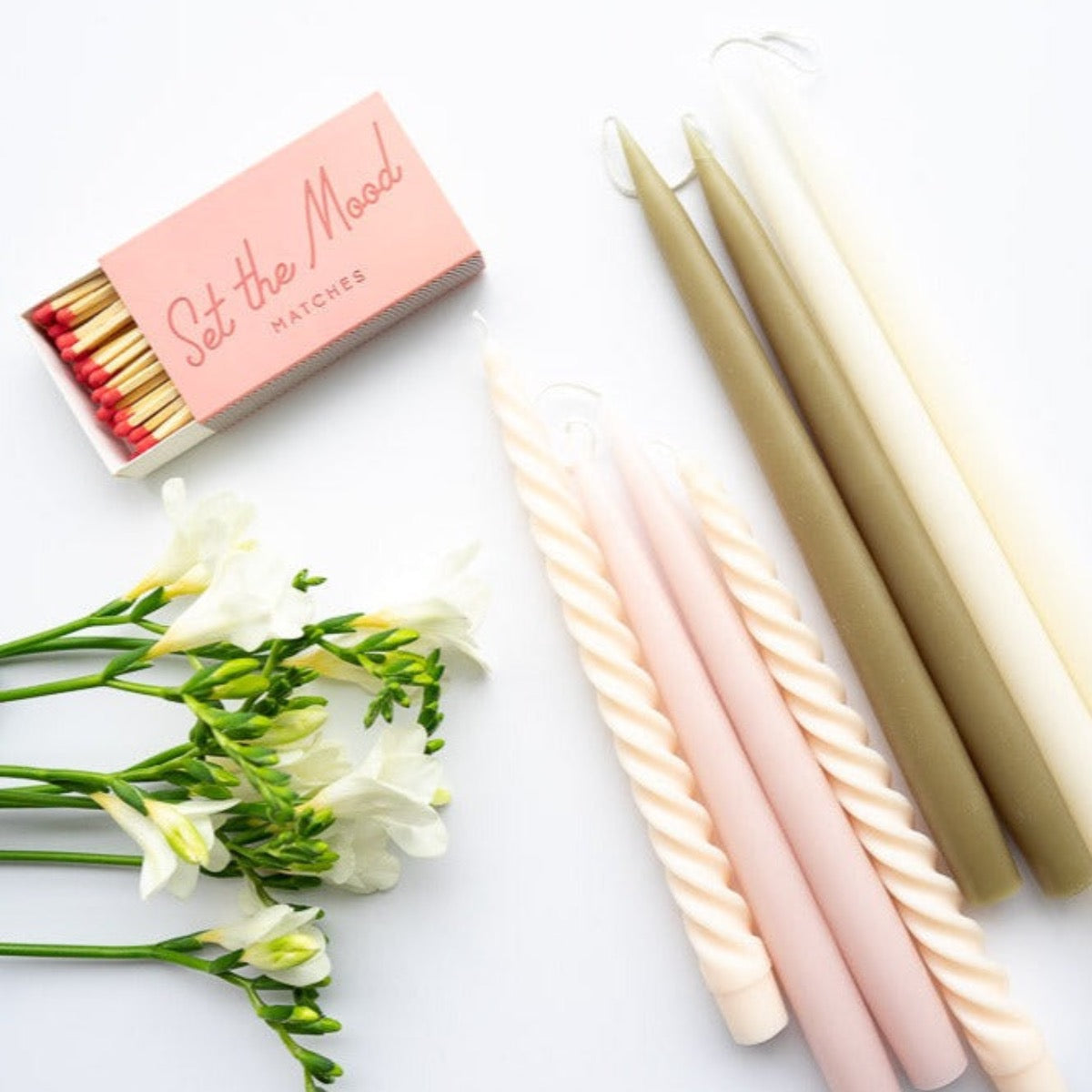 Hand-Dipped Danish Tapers - Olive styled with florals and matches. Styled view.