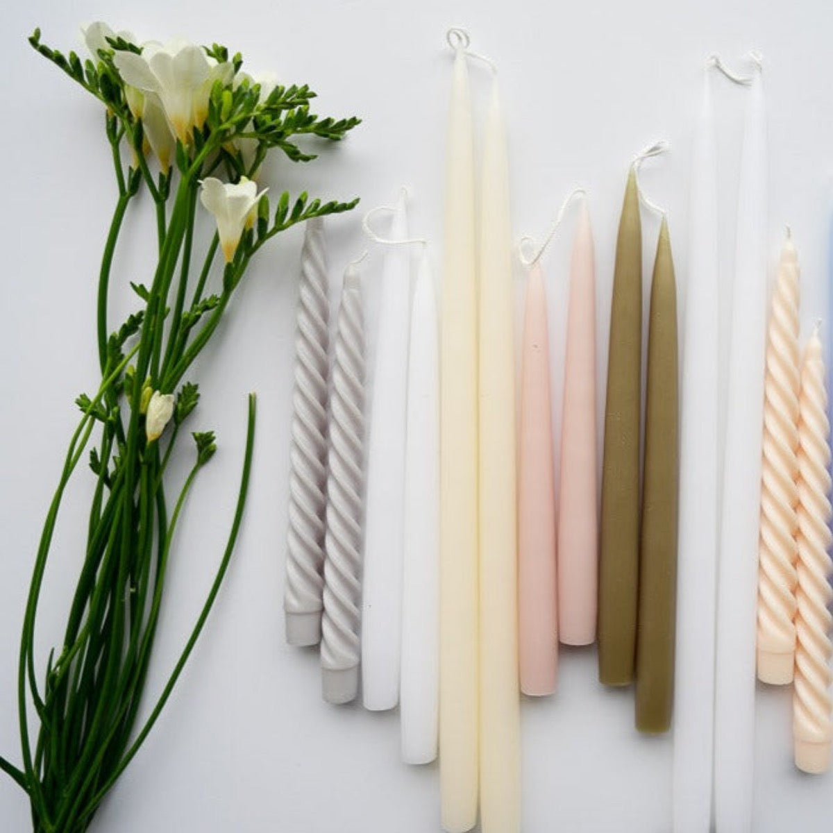 Hand-Dipped Danish Tapers - Olive styled with candles and greenery. Styled view.
