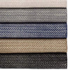 Herringbone Black Woven Cotton Rug styled with herringbone rugs. Styled view.