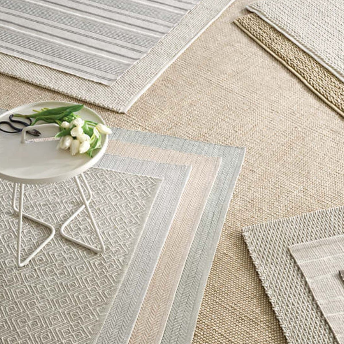 Herringbone Pearl Grey/White Indoor/Outdoor Rug styled with neutral rugs. Styled view.