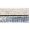 Homer Blue Loom Knotted Wool/Viscose Rug. Styled with a neutral rug. Styled view.