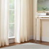 Honeycomb French Blue/Ivory Woven Wool Rug styled in a pale yellow living room with gold console table. Styled view.