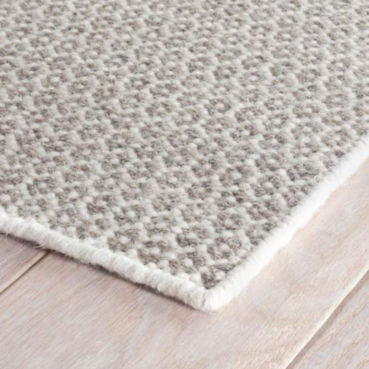 Honeycomb Ivory/Grey Woven Wool Rug corner detail. Close-up detail view.
