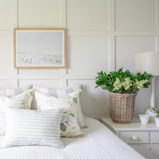 Idyllic Surf styled in a white bedroom. Styled view.