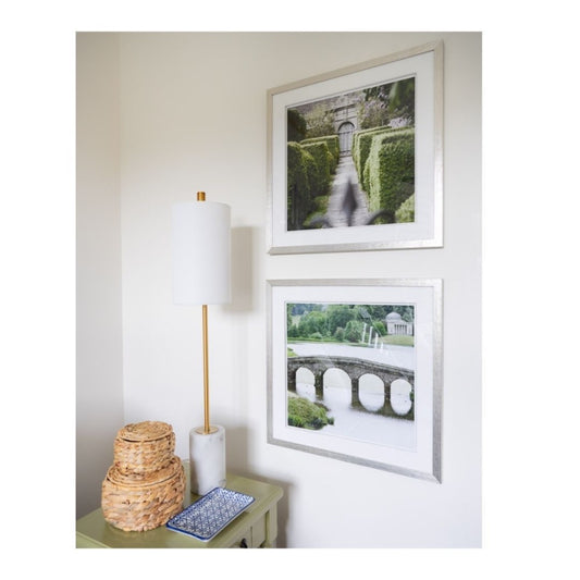 Jardin Vert Formel III styled on a white wall beside a green accent table. Styled view.