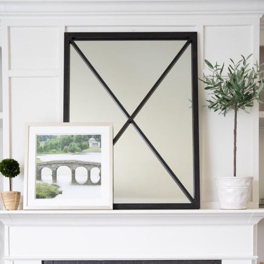 Jardin Vert Formel VI styled in front of black mirror on a white mantel. Styled view.