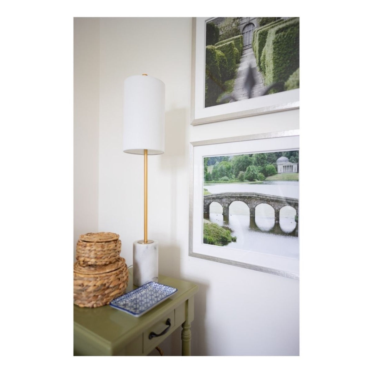 Jardin Vert Formel VI styled on white wall with green accent table. Styled view.