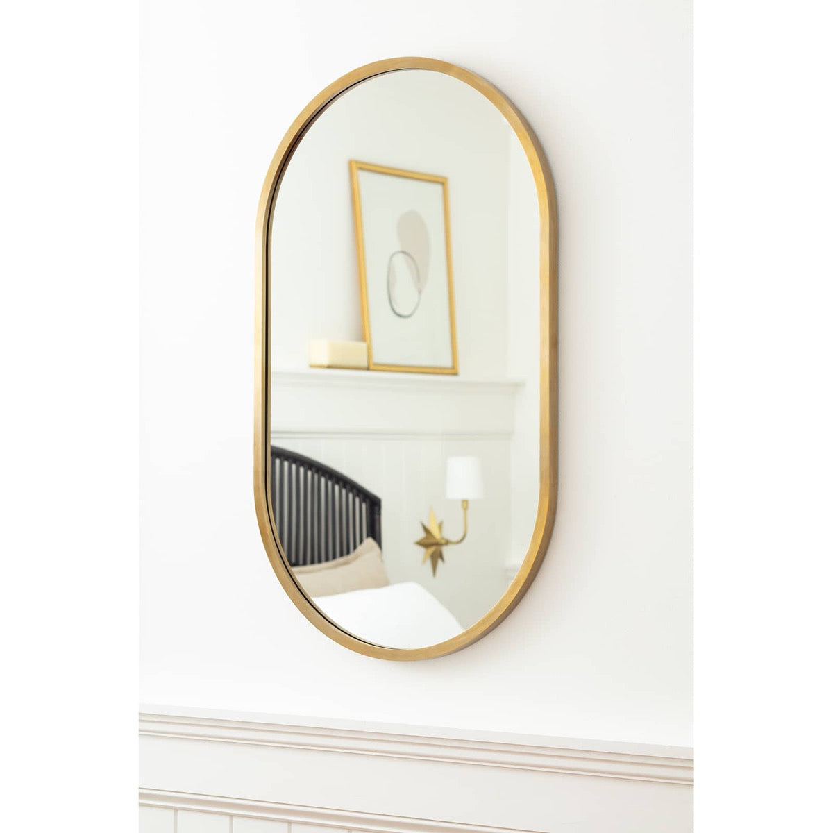 Josie Mirror on a white wall. Styled view.