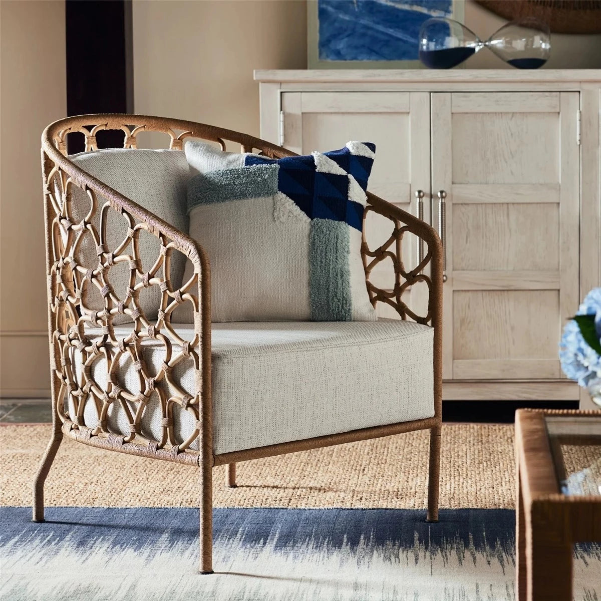Kinsley Accent Chair styled with a blue accent pillow in a living room. Styled view.