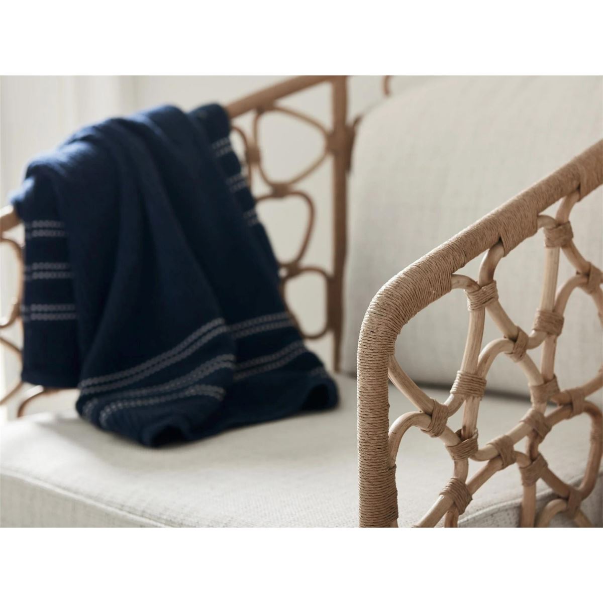 Kinsley Accent Chair styled with a blue throw. Detail view.