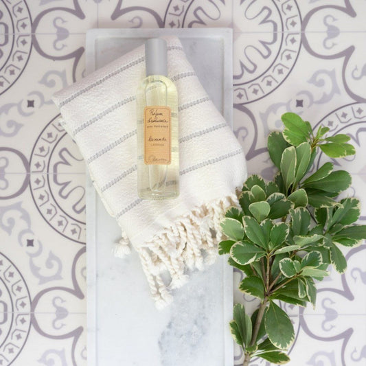 Long Marble Tray styled with soap, clothes and greenery. Styled view.