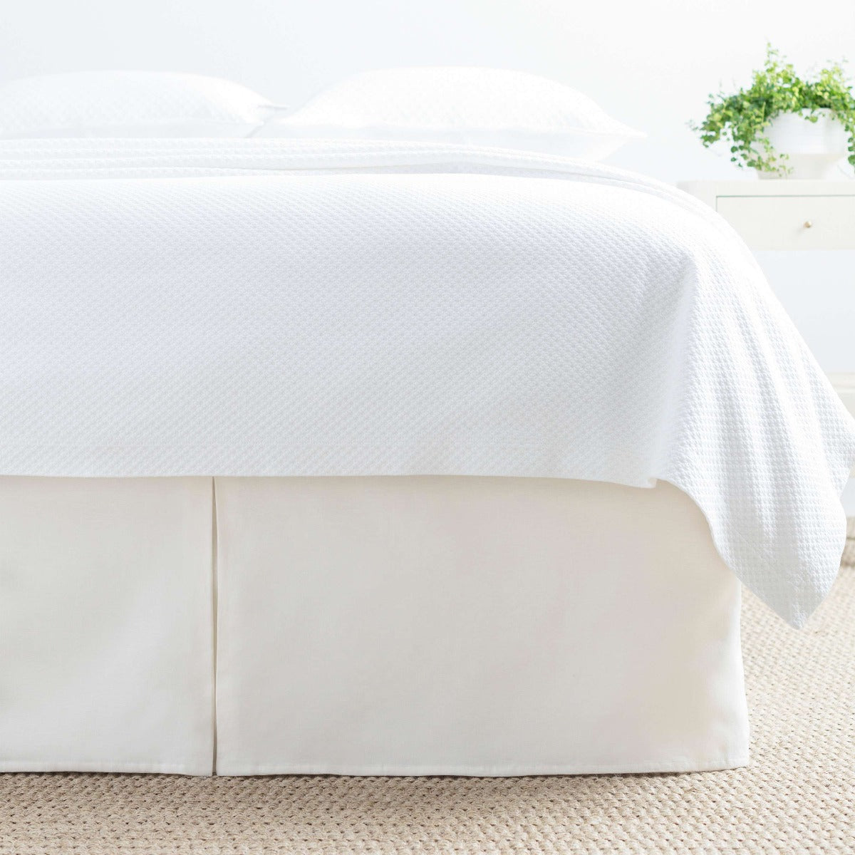 Lush Linen Ivory Bed Skirt styled with white bedding. Styled view. 