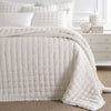 Lush Linen Ivory Puff styled with white sheets. Styled view.