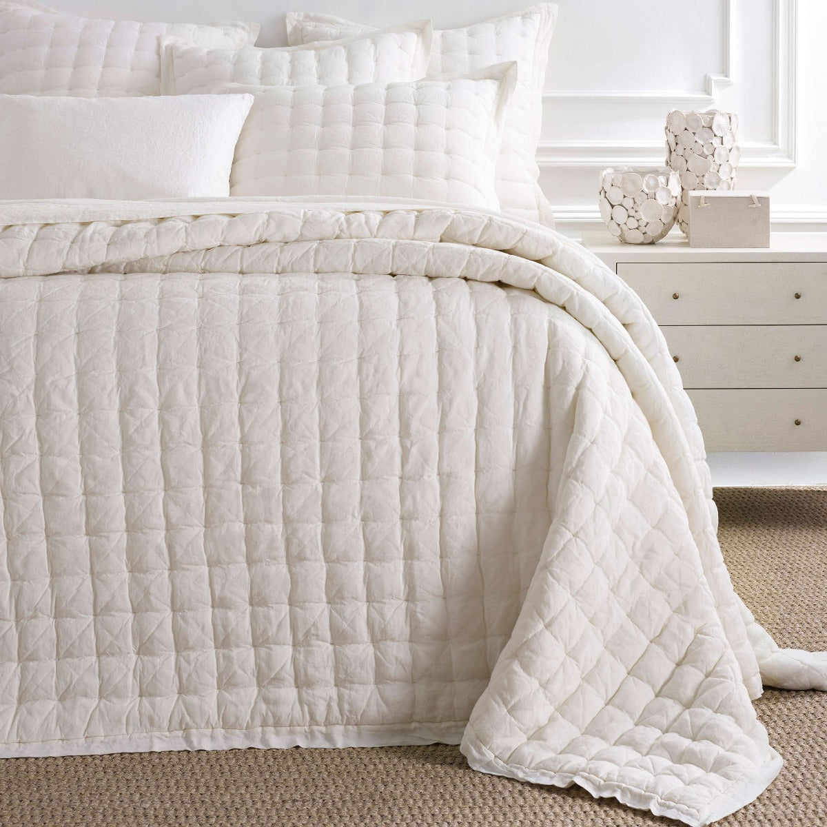 Lush Linen Ivory Puff styled with white sheets. Styled view.
