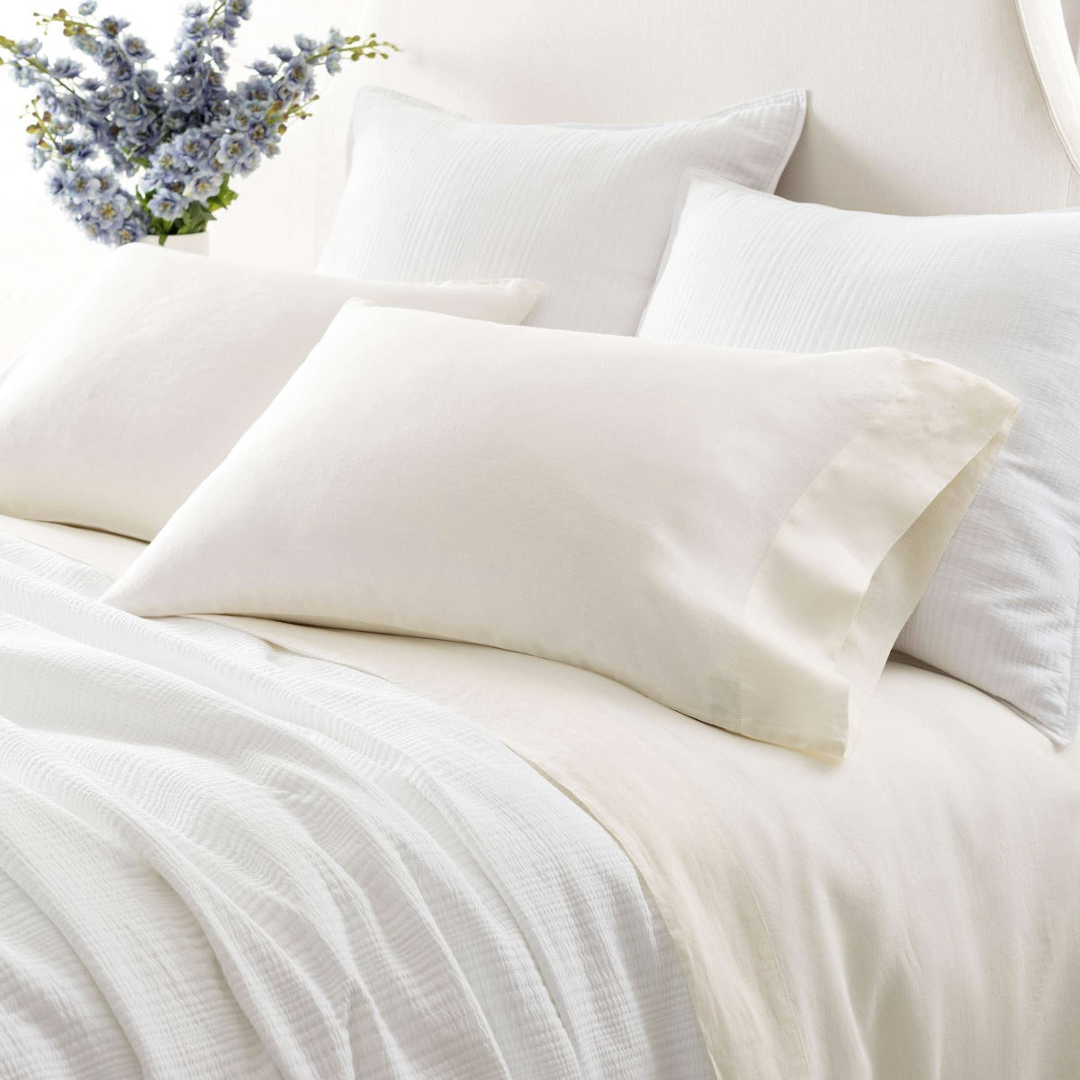 Lush Linen Ivory Sheet Set styled with white bedding. Styled view. 