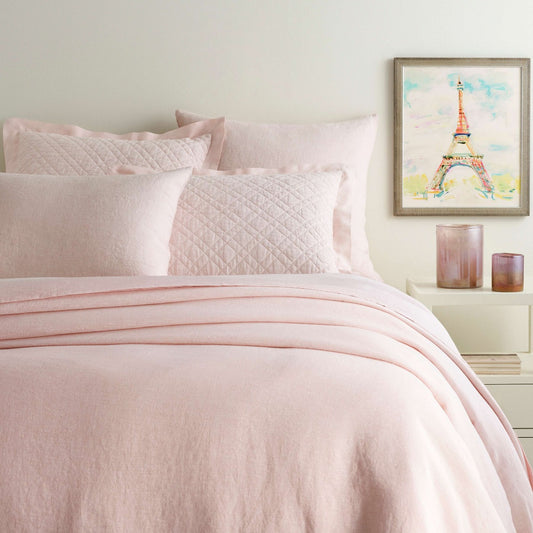 Lush Linen Slipper Pink Duvet Cover styled with pink sheets. Styled view.