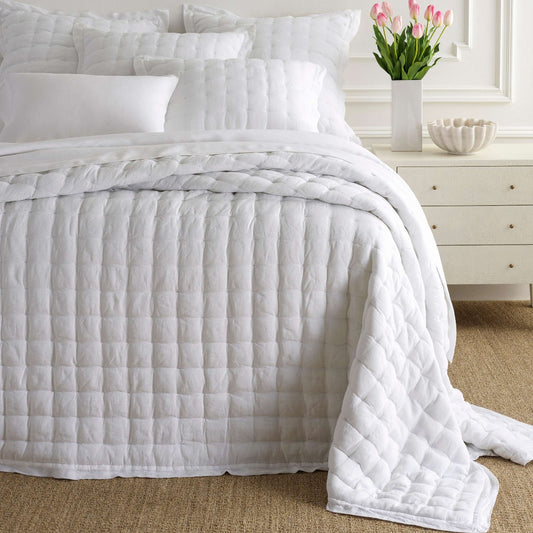 Lush Linen White Puff styled with white bedding. Styled view.