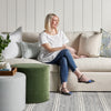 Margot Sofa styled with pillows, ottomans and spring decor. Styled view.