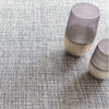Marled Indigo Woven Cotton Rug styled under decor. Styled view.