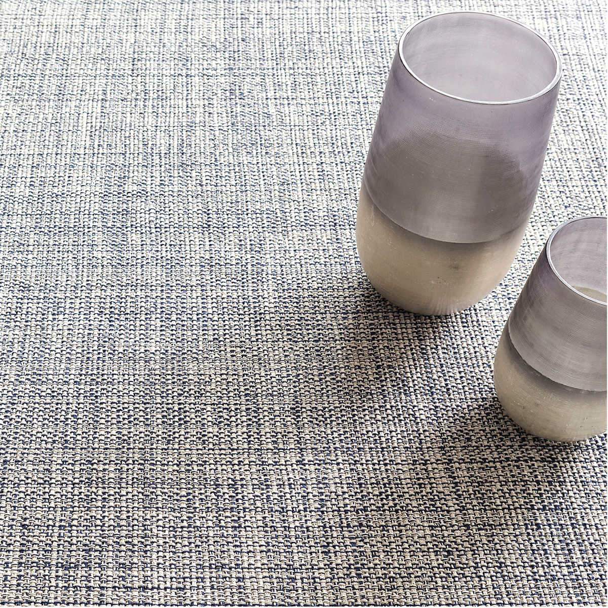 Marled Indigo Woven Cotton Rug styled under decor. Styled view.