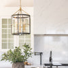 McGill Pendant styled over a white kitchen island with greenery. Styled view.