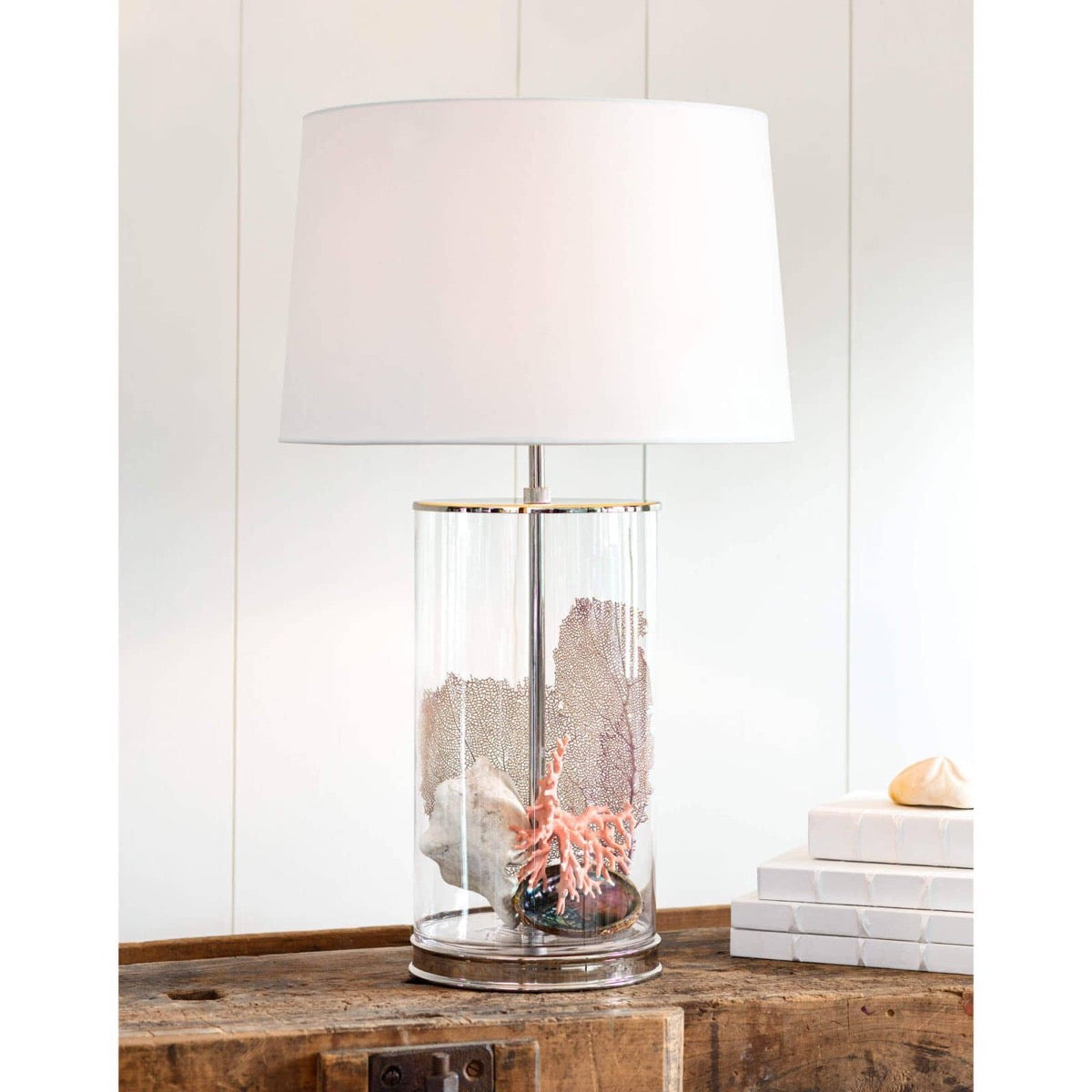 Magelian Glass Table Lamp styled with beach decor and books. Styled view.
